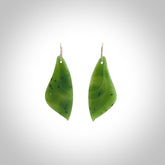 These are stunning large butterfly wing shaped drop jade earrings carved in New Zealand by Josey Coyle. It is carved from a deep, semi-translucent green piece of New Zealand Jade and with Sterling Silver hooks and findings.